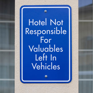 Hotel not responsible for valuables left in vehicles sign
